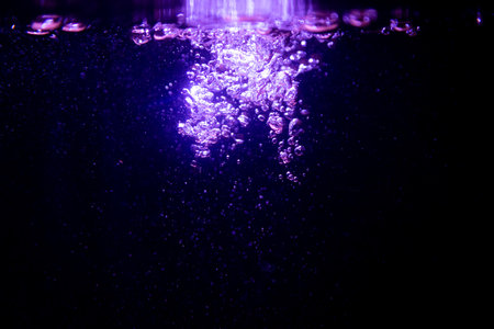 Abstract purple bokeh glitter lights defocused backgroundの写真素材