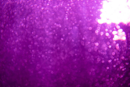 Abstract purple bokeh glitter lights defocused backgroundの写真素材