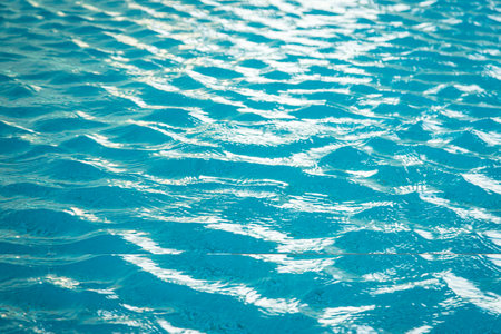 Blue water ripple reflection in the swimming pool nature backgroundの写真素材