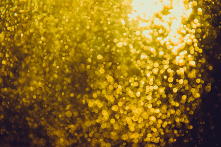 Abstract gold bokeh luxury with black backgroundの写真素材