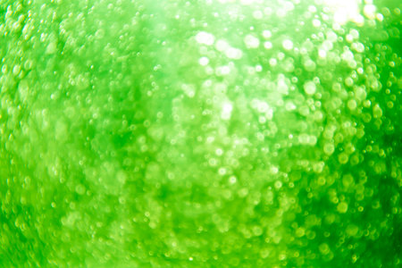 green bokeh natural on black backgroundの写真素材