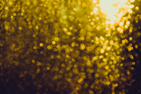 Abstract gold bokeh luxury with black backgroundの写真素材