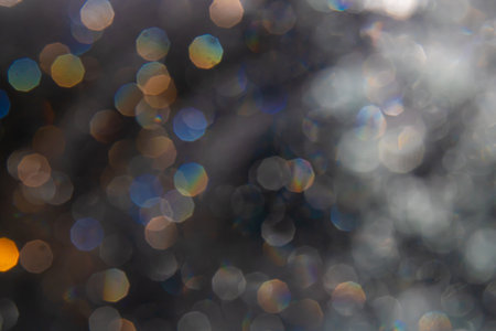 bokeh of lights from water on black backgroundの写真素材