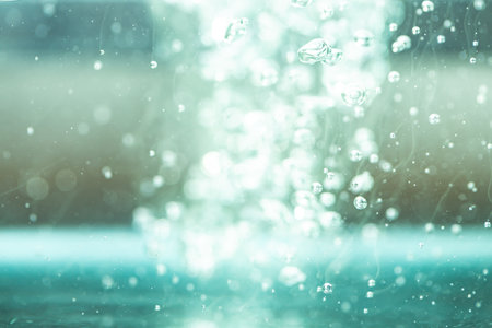 Bokeh of water on the background blurred the natural blue and white. Bokeh colorful glows sparkle beautiful Valentines Day concept. New year day and Christmas'dayの写真素材