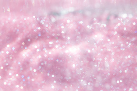 Pink abstract sparkles or glitter lights Defocused circles bokeh backgroundの写真素材