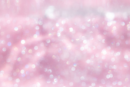 Pink abstract sparkles or glitter lights Defocused circles bokeh backgroundの写真素材