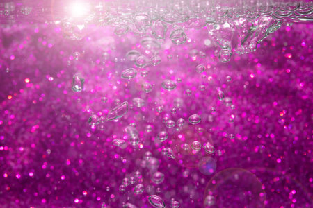 Abstract purple bokeh with black background.の写真素材