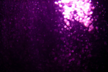 Abstract purple bokeh glitter lights defocused backgroundの写真素材