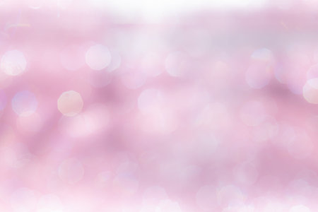 Pink abstract sparkles or glitter lights Defocused circles bokeh backgroundの写真素材