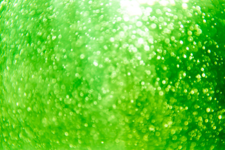 green bokeh natural on black backgroundの写真素材