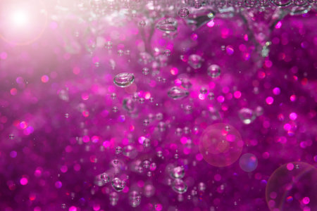 Abstract purple bokeh with black background.の写真素材
