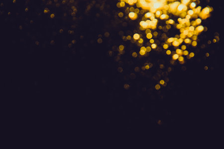 Abstract gold bokeh luxury with black backgroundの写真素材