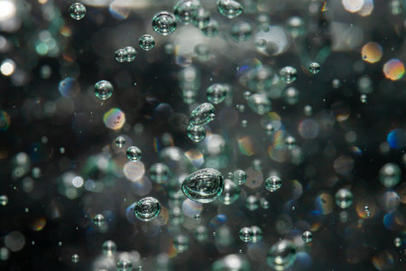 bokeh of lights from water on black backgroundの写真素材
