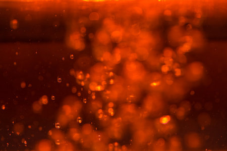 Red bokeh of lights on black backgroundの写真素材