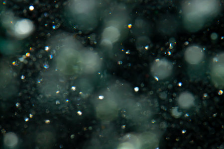 bokeh of lights from water on black backgroundの写真素材