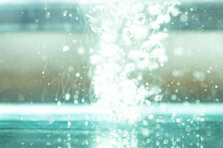 Bokeh of water on the background blurred the natural blue and white. Bokeh colorful glows sparkle beautiful Valentines Day concept. New year day and Christmas'dayの写真素材