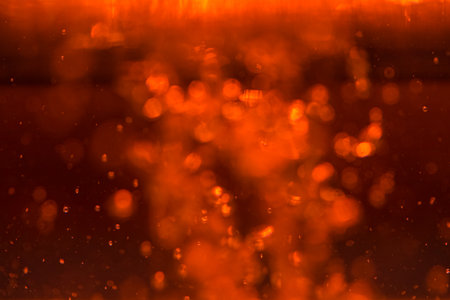 Red bokeh of lights on black backgroundの写真素材