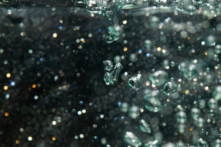 bokeh of lights from water on black backgroundの写真素材