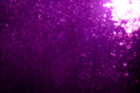 Abstract purple bokeh glitter lights defocused backgroundの写真素材