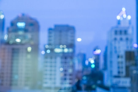 Blur image of city scape building in the night with light bokeh backgroundの写真素材