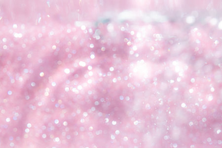 Pink abstract sparkles or glitter lights Defocused circles bokeh backgroundの写真素材