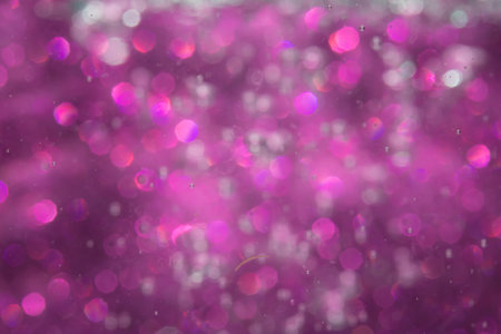 Abstract purple bokeh with black background.の写真素材
