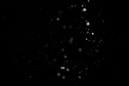 black bokeh on a black background. abstract black background.の写真素材