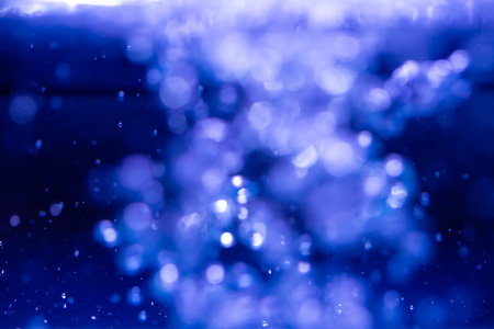 Abstract Blue bokeh defocus glitter of light blur backgroundの写真素材