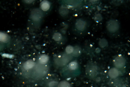 bokeh of lights from water on black backgroundの写真素材