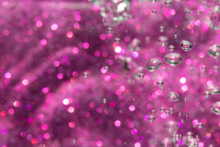 Fantasy abstract blur purple bokeh of lights colorful sparkle use for backgroundの写真素材