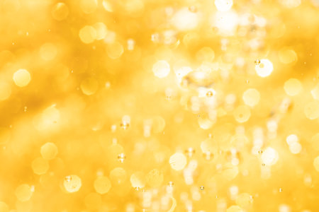 Abstract gold bokeh defocus glitter of light blur backgroundの写真素材