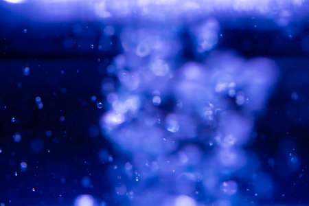 Abstract Blue bokeh defocus glitter of light blur backgroundの写真素材