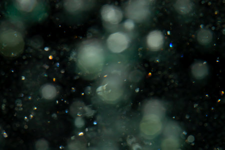 bokeh of lights from water on black backgroundの写真素材