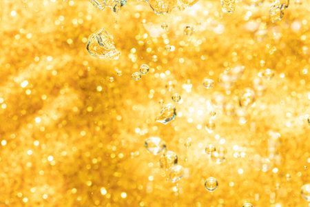 Abstract gold bokeh defocus glitter of light blur backgroundの写真素材