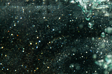 bokeh of lights from water on black backgroundの写真素材