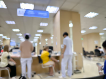 Blurred image of patients coming for check-ups in a modern hospital backgroundの写真素材