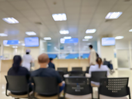 Blurred image of patients coming for check-ups in a modern hospital backgroundの写真素材