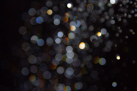 Bokeh blur on black background Looks luxurious, glittering, suitable conveying luxuryの写真素材