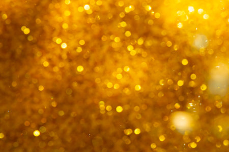 golden glitter christmas abstract background, defocused bokeh lightsの写真素材