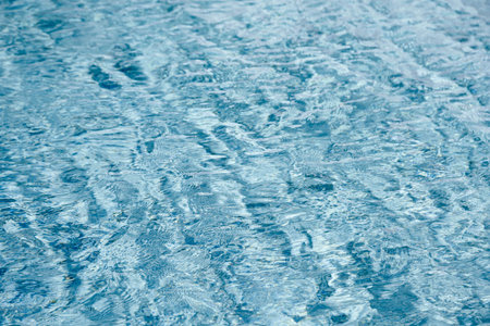 abstract blue color water wave in swimming pool pure natural swirl pattern texture use for backgroundの写真素材