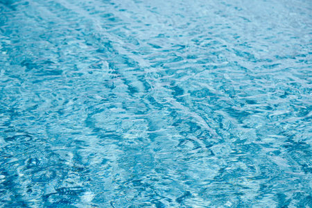 abstract blue color water wave in swimming pool pure natural swirl pattern texture use for backgroundの写真素材