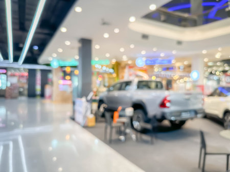 Blurred image of people walking and shoping at atmosphere of shopping in a leading shopping center decorated in a modern way backgroundの写真素材