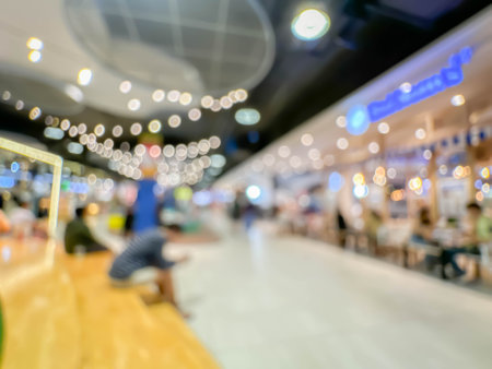 Blurred image of people walking and shoping at atmosphere of shopping in a leading shopping center decorated in a modern way backgroundの写真素材
