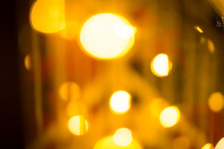 close-up blurred photo Golden decorative lights create a luxurious atmosphere at night events. Helps to take beautiful, easy and interesting photos.の写真素材