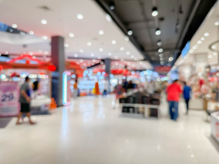 Blurred image of people walking and shoping at atmosphere of shopping in a leading shopping center decorated in a modern way backgroundの写真素材