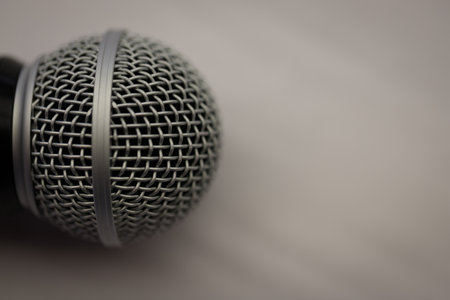 Close up of microphone on a podium in an auditorium with vintage backgroundの写真素材