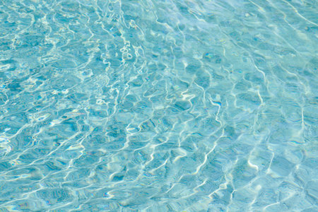 abstract blue color water wave in swimming pool pure natural swirl pattern texture use for backgroundの写真素材