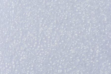 Close-up shot of White foam board. show texture Detail of plastic material. with Synthetic Suitable for use as background images or decorationsの写真素材