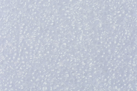 Close-up shot of White foam board. show texture Detail of plastic material. with Synthetic Suitable for use as background images or decorationsの写真素材