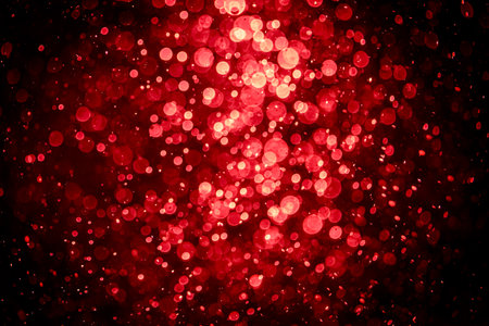 Blurred photo with red dots visible glittering, shining brightly look and feel luxurious Suitable for use as a wallpaperの写真素材